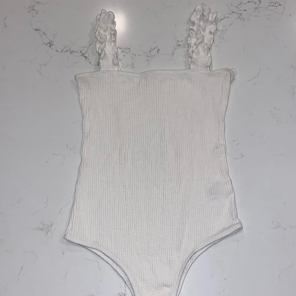 White bodysuit size small. Brand is wishlist.